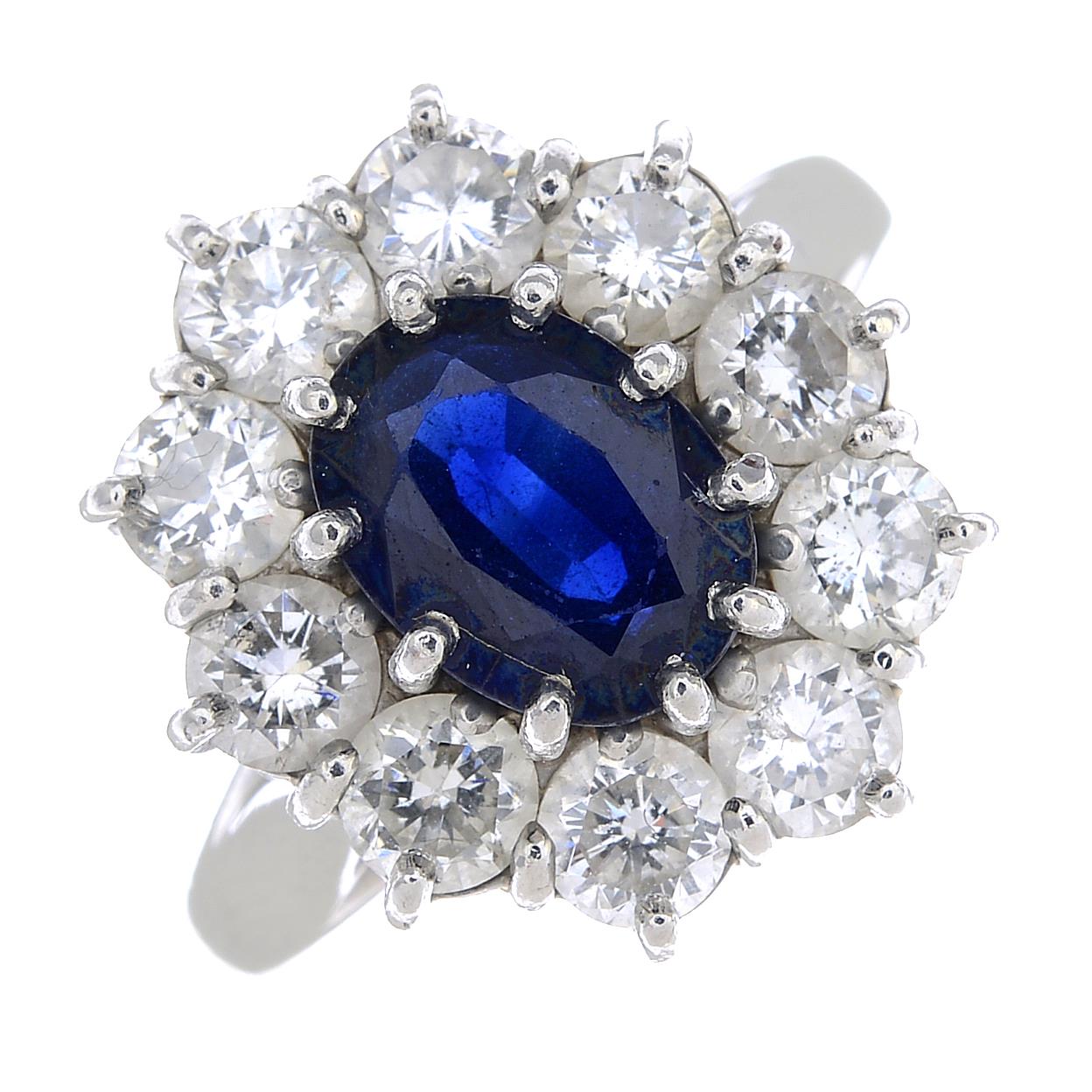 (64015) A platinum sapphire and diamond ring.