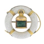 An enamel and green gem brooch.