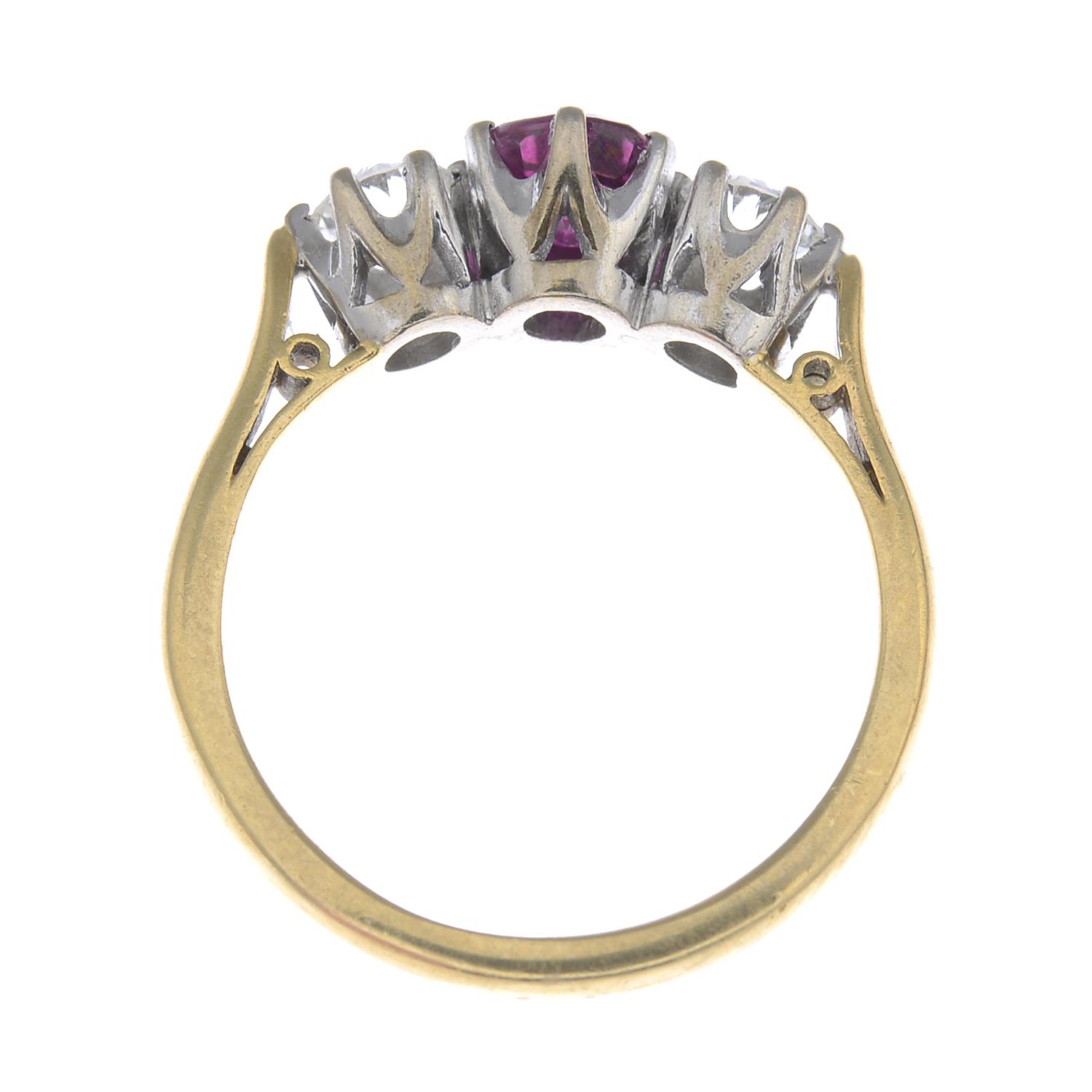 An 18ct gold ruby and diamond three-stone ring. - Image 2 of 3