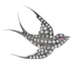 A diamond bird brooch.