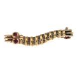 A gold 'caterpillar club' brooch.