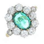 An early 20th century 18ct gold Colombian emerald and diamond cluster ring.