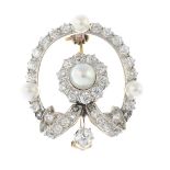 An early 20th century platinum and gold, natural pearl and diamond brooch.