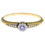 An early 20th century 14ct gold sapphire and diamond hinged bangle.