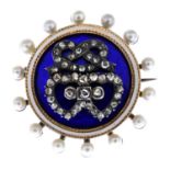 A late Victorian silver and gold, diamond, enamel and seed pearl brooch.