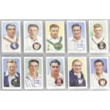 A collection of assorted cigarette cards,