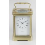 A late 19th century brass cased carriage clock with 2 inch (5cm) white enamelled Roman dial