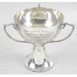 An Edwardian Art Nouveau silver trophy,