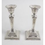 A pair of modern silver mounted candlesticks,