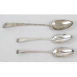 A George III silver basting spoon and a pair of slightly later table spoons,