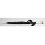 A 9ct gold and ivory handled ladies black fabric parasol,