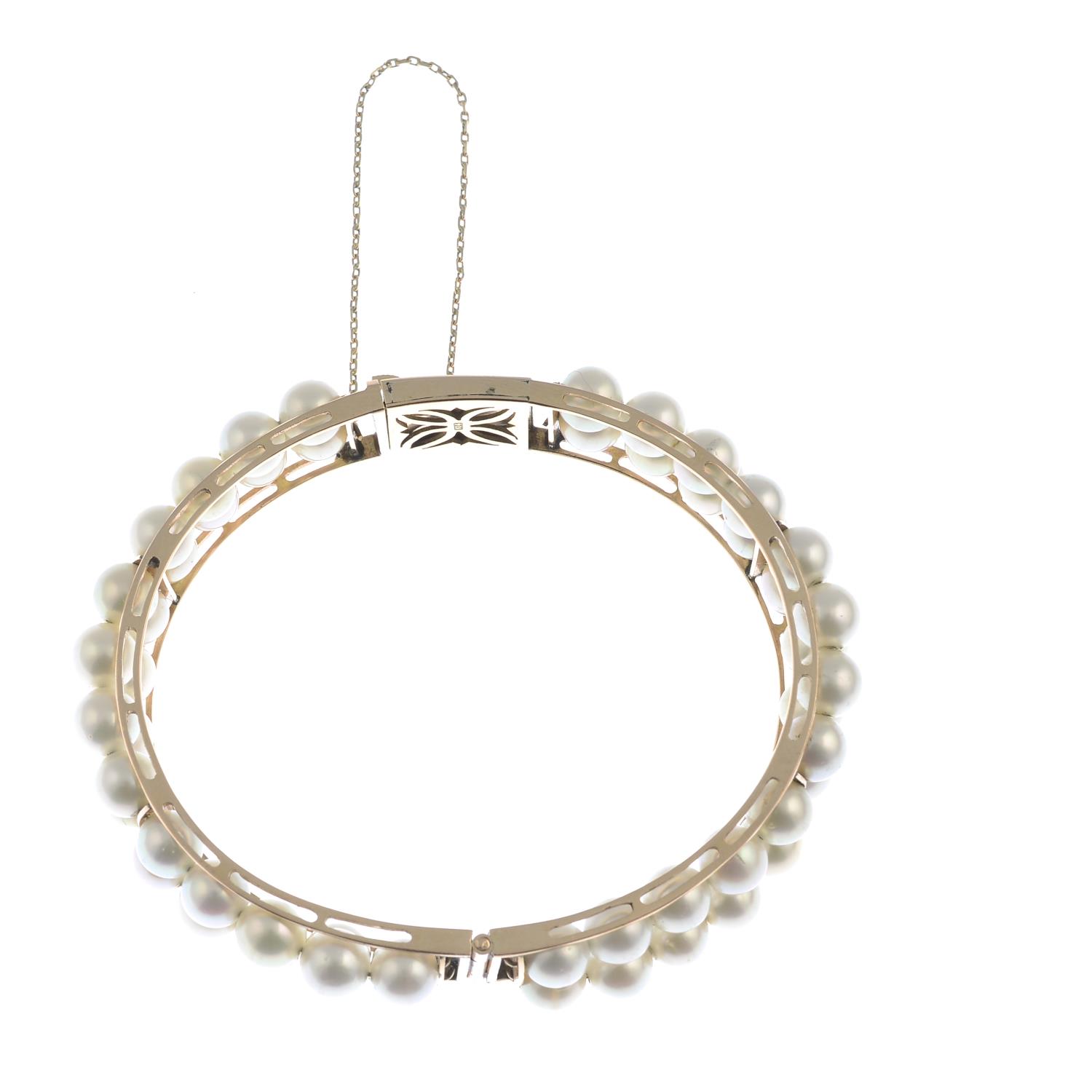 A cultured pearl hinged bangle. - Image 2 of 3