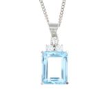 An 18ct gold aquamarine and diamond pendant.