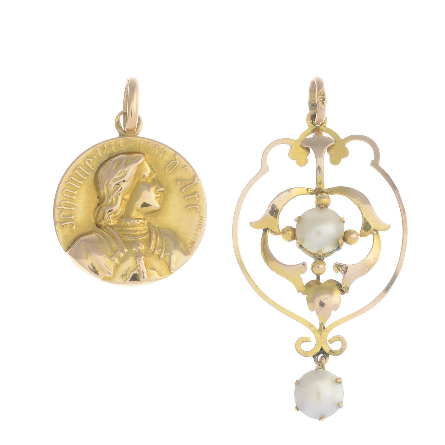 A selection of four early 20th century gold pendants.