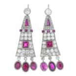 A pair of ruby and diamond earrings.