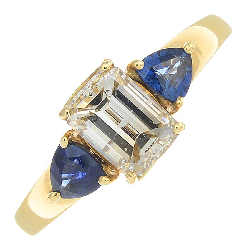 A 14ct gold diamond and sapphire three-stone ring.