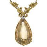 A citrine and diamond pendant.