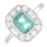 An emerald and diamond dress ring.