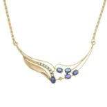 A sapphire and diamond necklace.