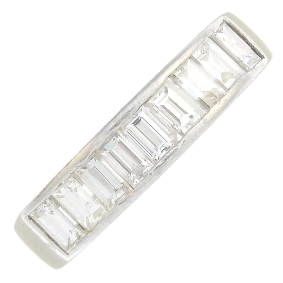 A platinum diamond half eternity ring.