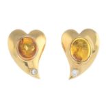 A pair of amber and diamond earrings.