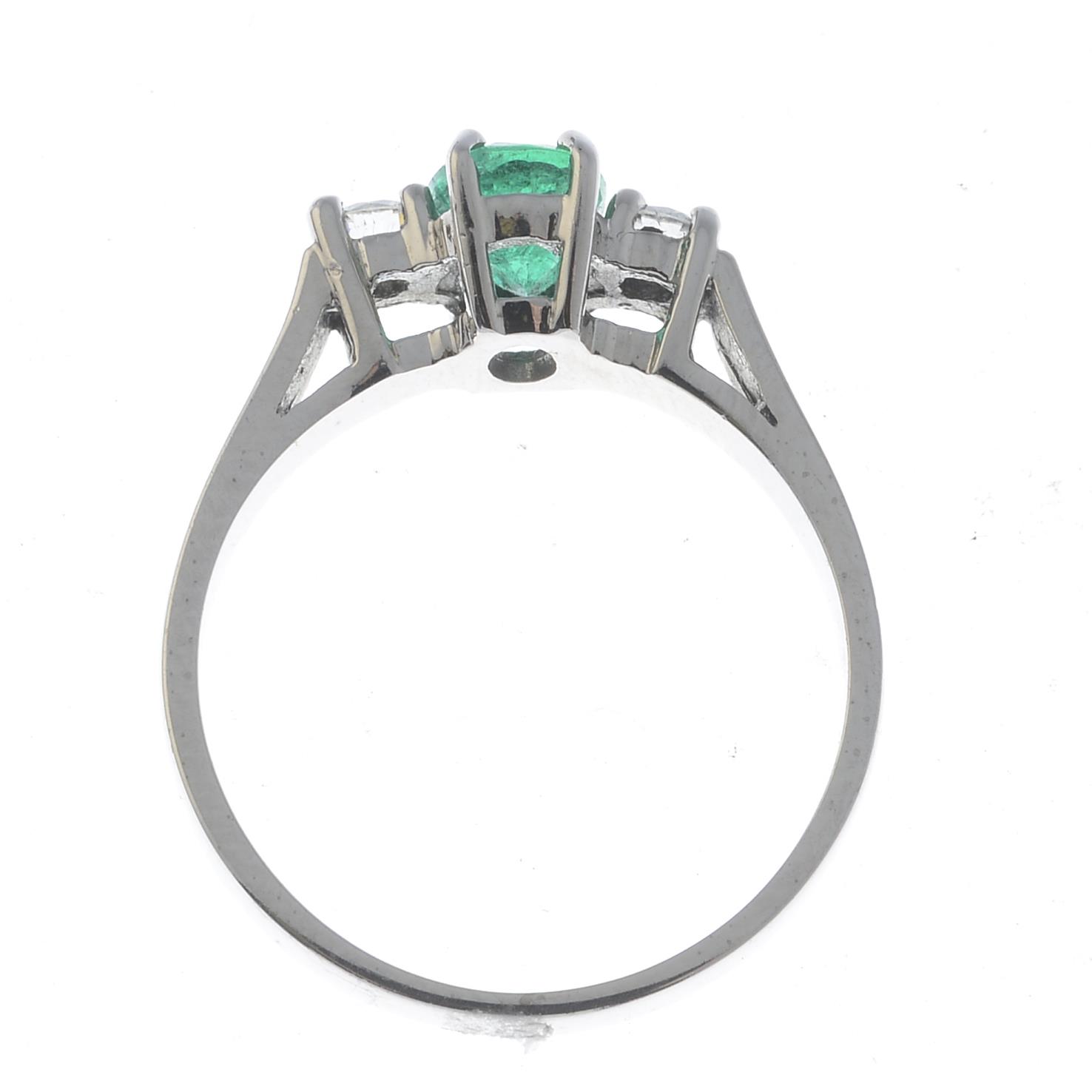 An 18ct gold emerald and diamond three-stone ring. - Image 3 of 3