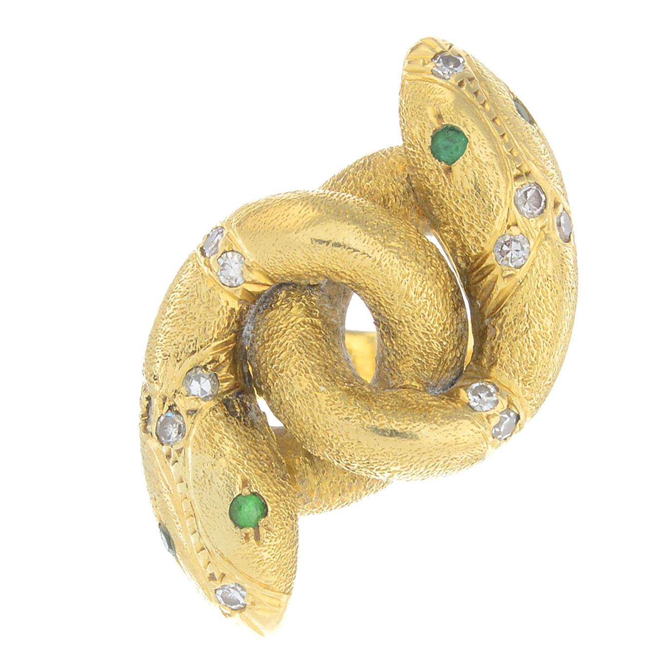 A diamond and emerald snake ring.