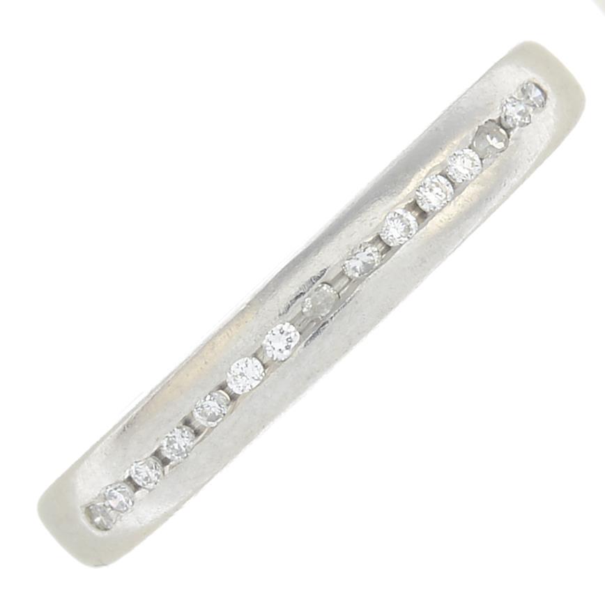 A platinum diamond half eternity ring.