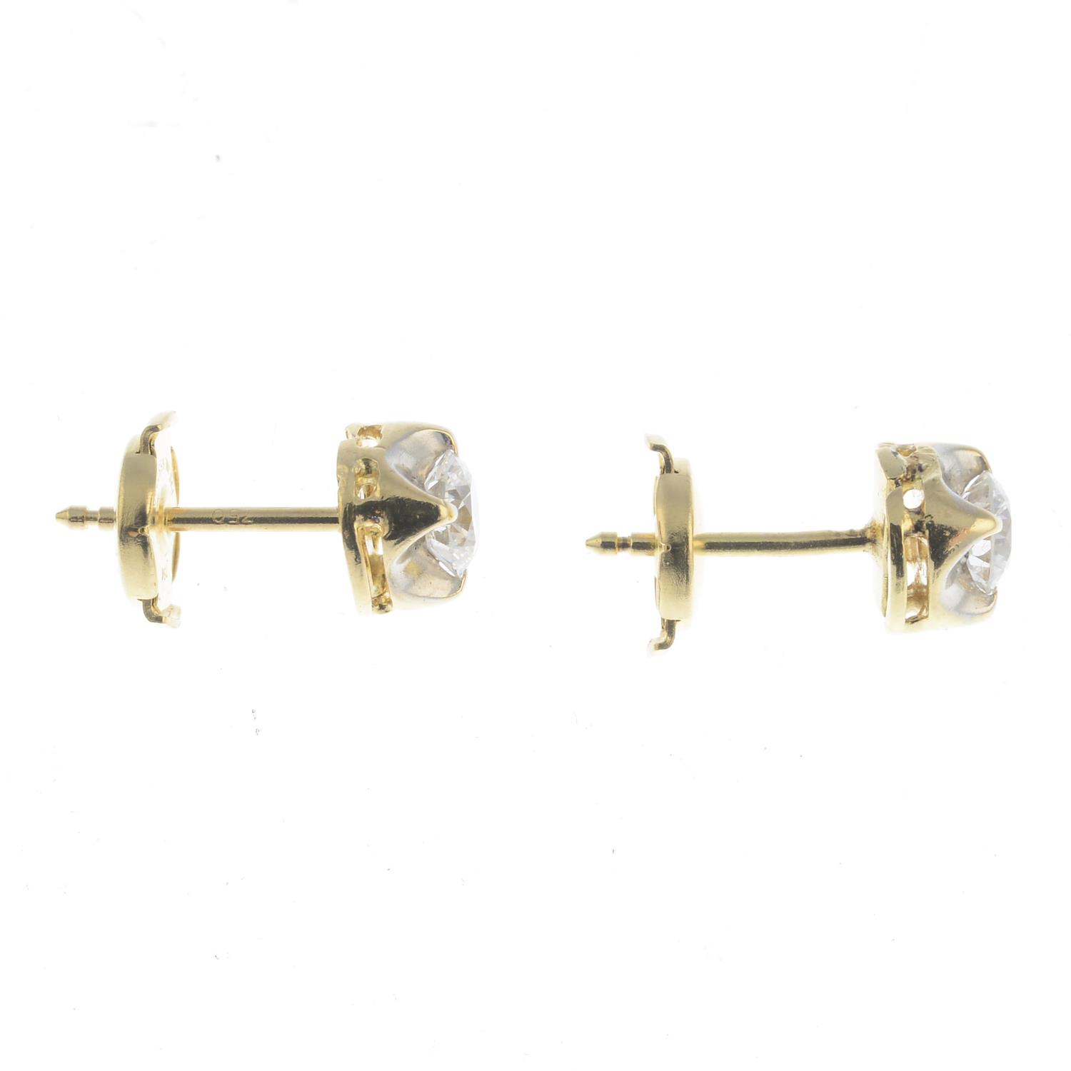 A pair of brilliant-cut diamond stud earrings. - Image 2 of 2