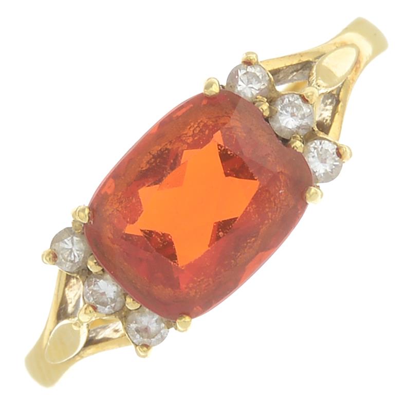 An 18ct gold fire opal and diamond ring.