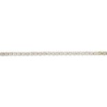 An 18ct gold diamond line bracelet.