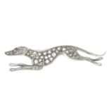 A diamond and gem-set dog brooch.