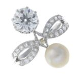 A diamond and natural pearl dress ring.