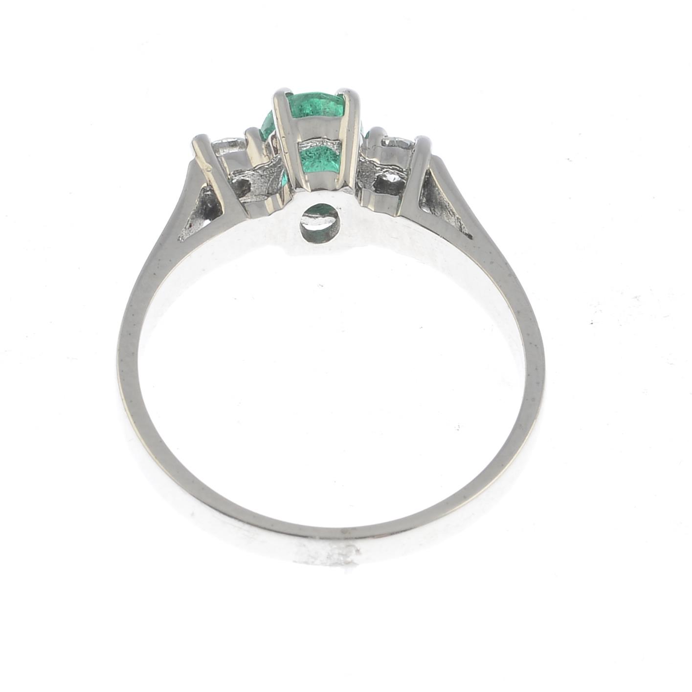 An 18ct gold emerald and diamond three-stone ring. - Image 2 of 3