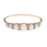 A late Victorian 18ct gold opal and diamond bangle.