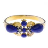 A lapis lazuli and diamond hinged bangle.
