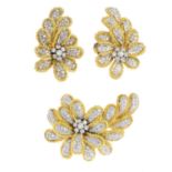 A diamond brooch and earrings.