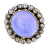 A gold and silver, Sri Lankan star sapphire and diamond cluster ring.