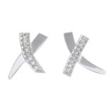 TIFFANY & CO. - a pair of diamond 'Kiss' earrings.