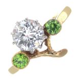 A diamond and demantoid garnet floral dress ring.