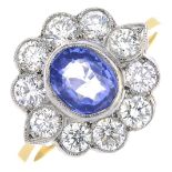 A sapphire and diamond cluster ring.