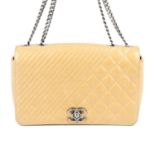 CHANEL - a Glazed Calfskin Quilted Medium Coco Boy Flap handbag.