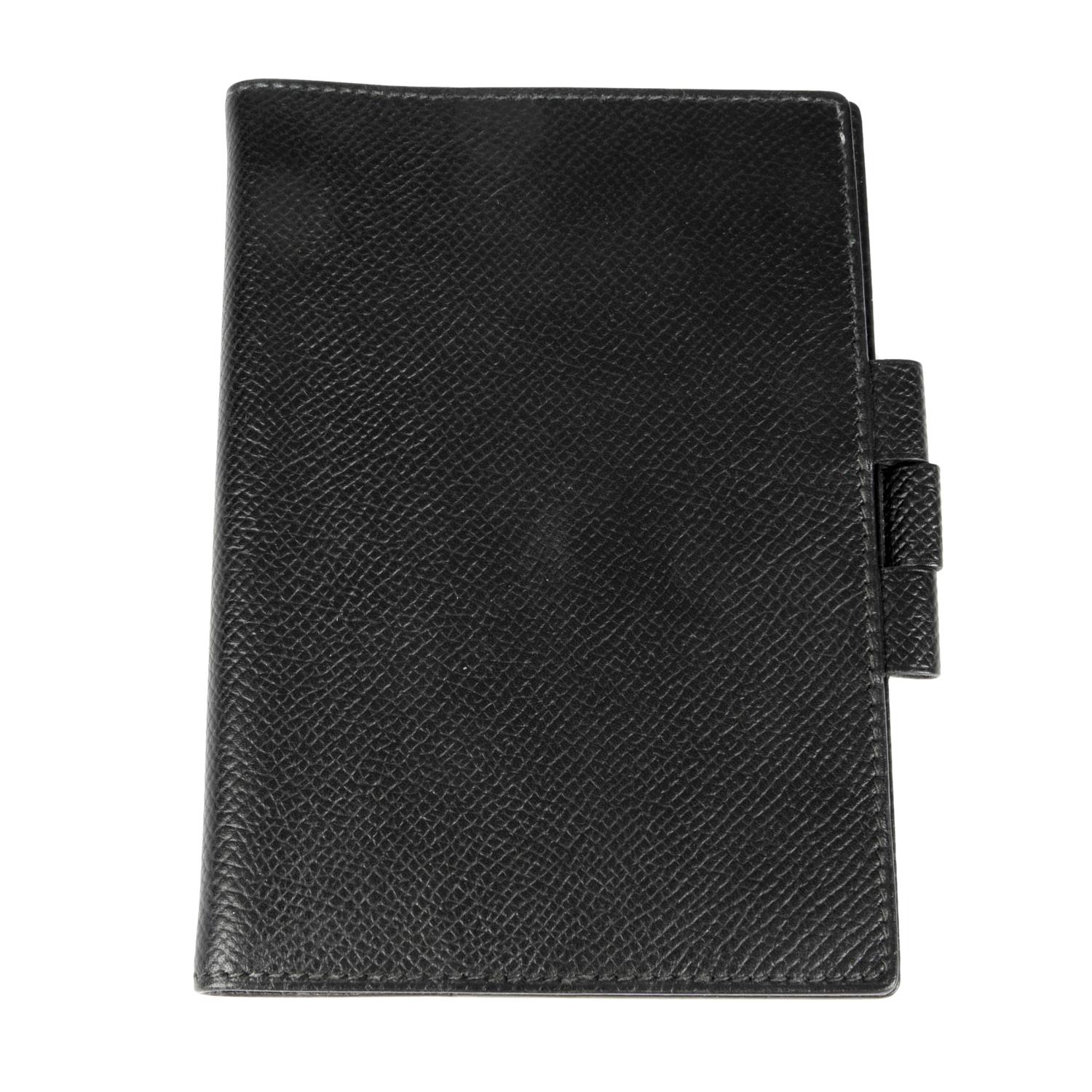 HERMÈS - a small black leather Vision agenda cover.