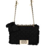 CAROLINE HERRERA - a black quilted tweed handbag.