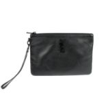 YVES SAINT LAURENT - a black leather clutch.