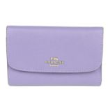 COACH - a purple pebbled Medium Envelope wallet.