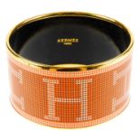 HERMÈS - an extra wide enamel bangle.