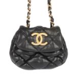 CHANEL - a mini quilted purse.