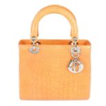 CHRISTIAN DIOR - a limited edition peach crocodile Lady Dior handbag.