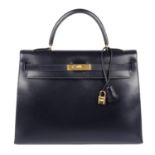 HERMÈS - a 1999 navy blue Box Calf Kelly Sellier 35 handbag.